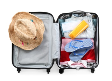 Packed suitcase with summer clothes on white background, top view