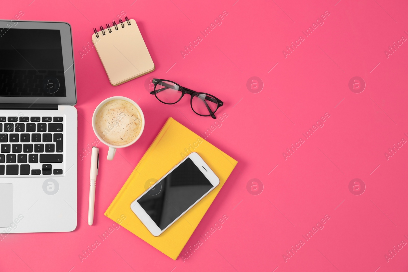 Photo of Flat lay composition with modern devices and office tools on pink background. Space for text