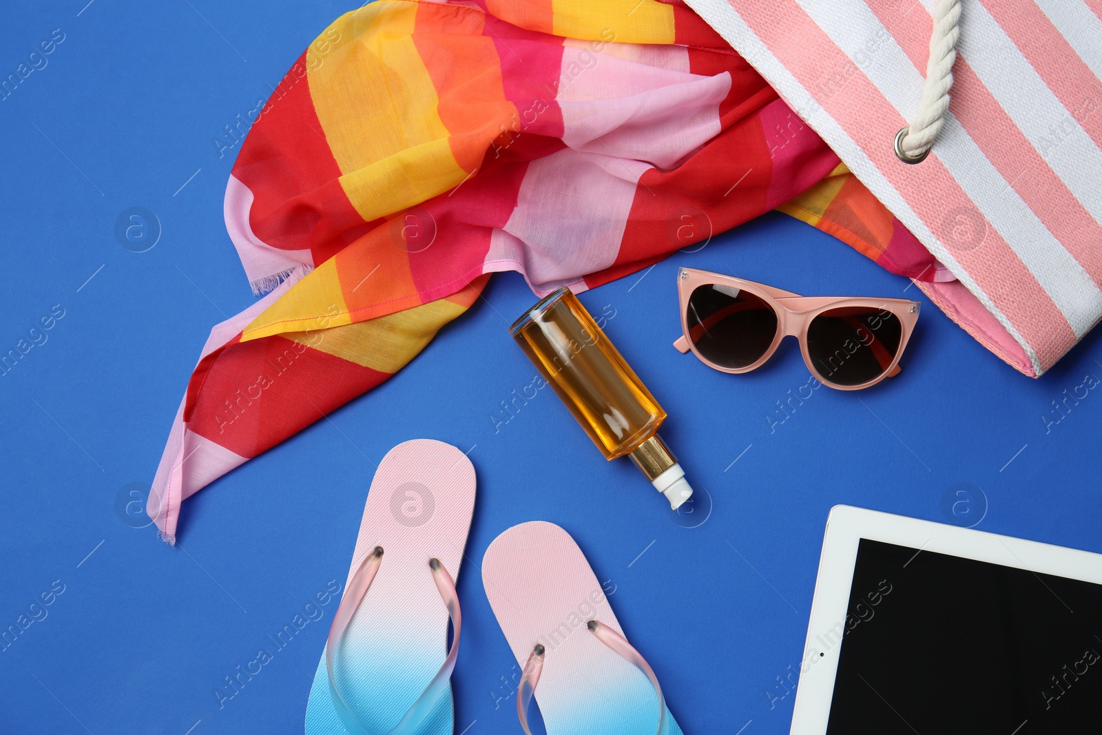 Photo of Flat lay composition with beach objects on color background