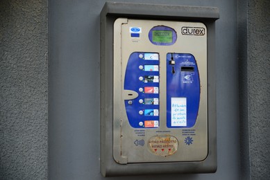 Photo of Ripe (AN), Marche, Italy – APRIL 07, 2022: Durex condom vending machine on grey wall