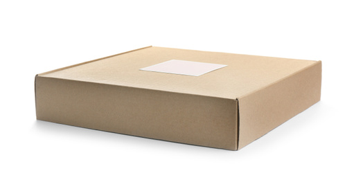 Photo of One closed cardboard box isolated on white