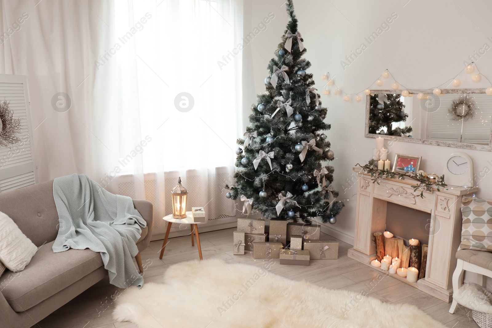 Photo of Stylish living room interior with decorated Christmas tree