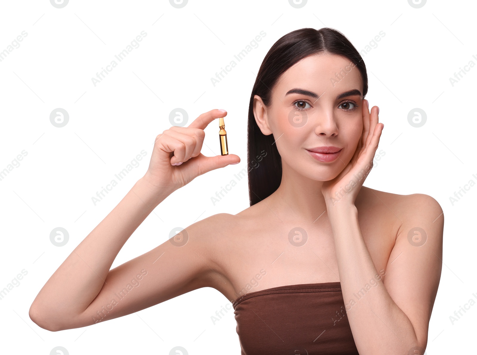 Photo of Beautiful young woman holding skincare ampoule on white background