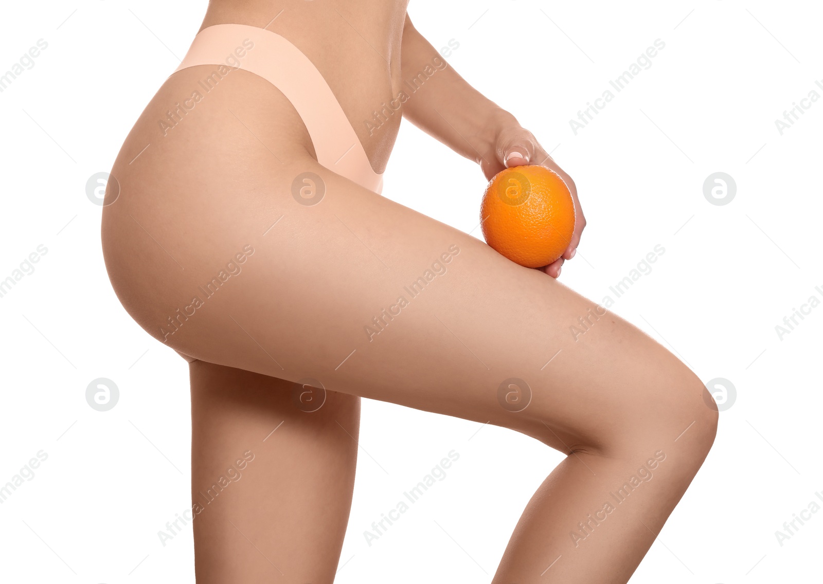 Photo of Closeup view of slim woman in underwear with orange on white background. Cellulite problem concept