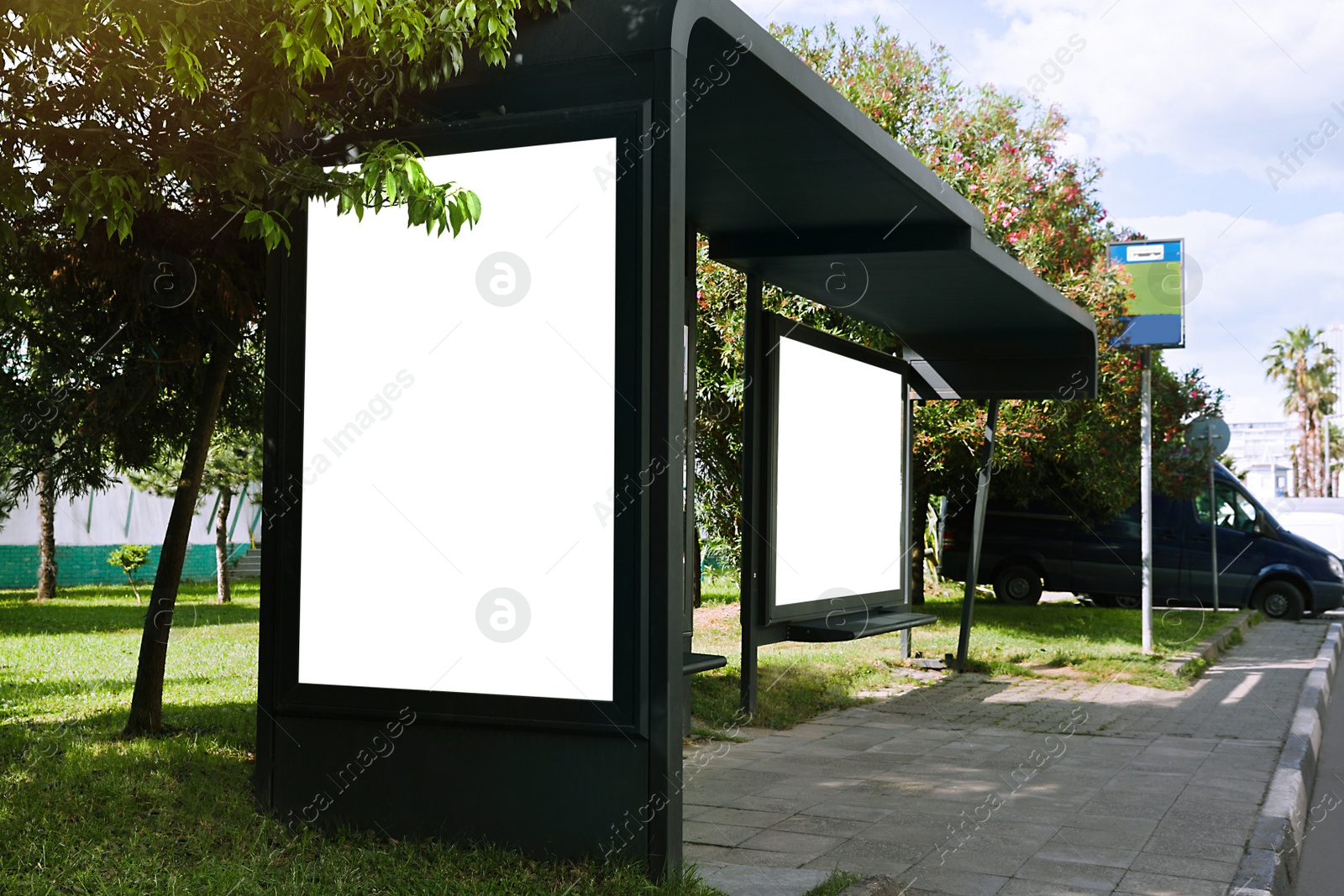 Photo of Blank advertising boards on transport stop. Space for design