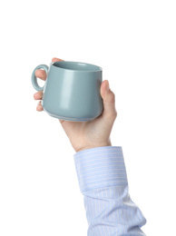 Woman holding cup on white background, closeup