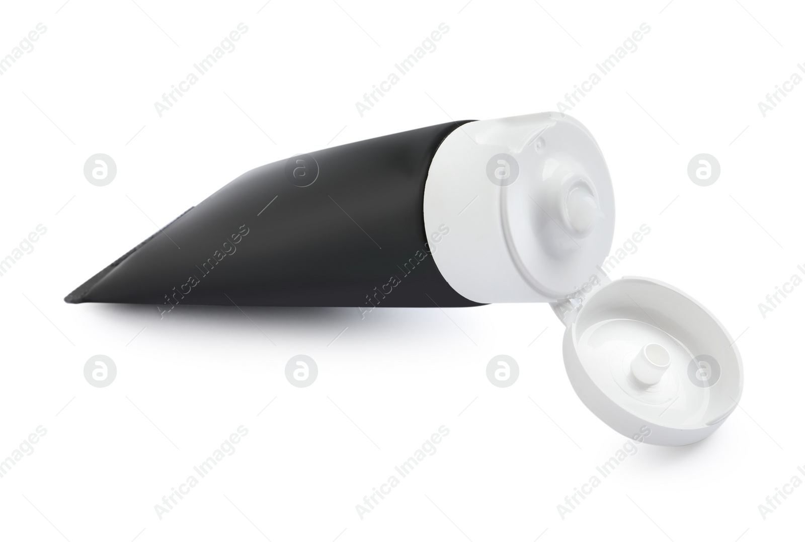 Photo of Open tube of men's facial cream isolated on white