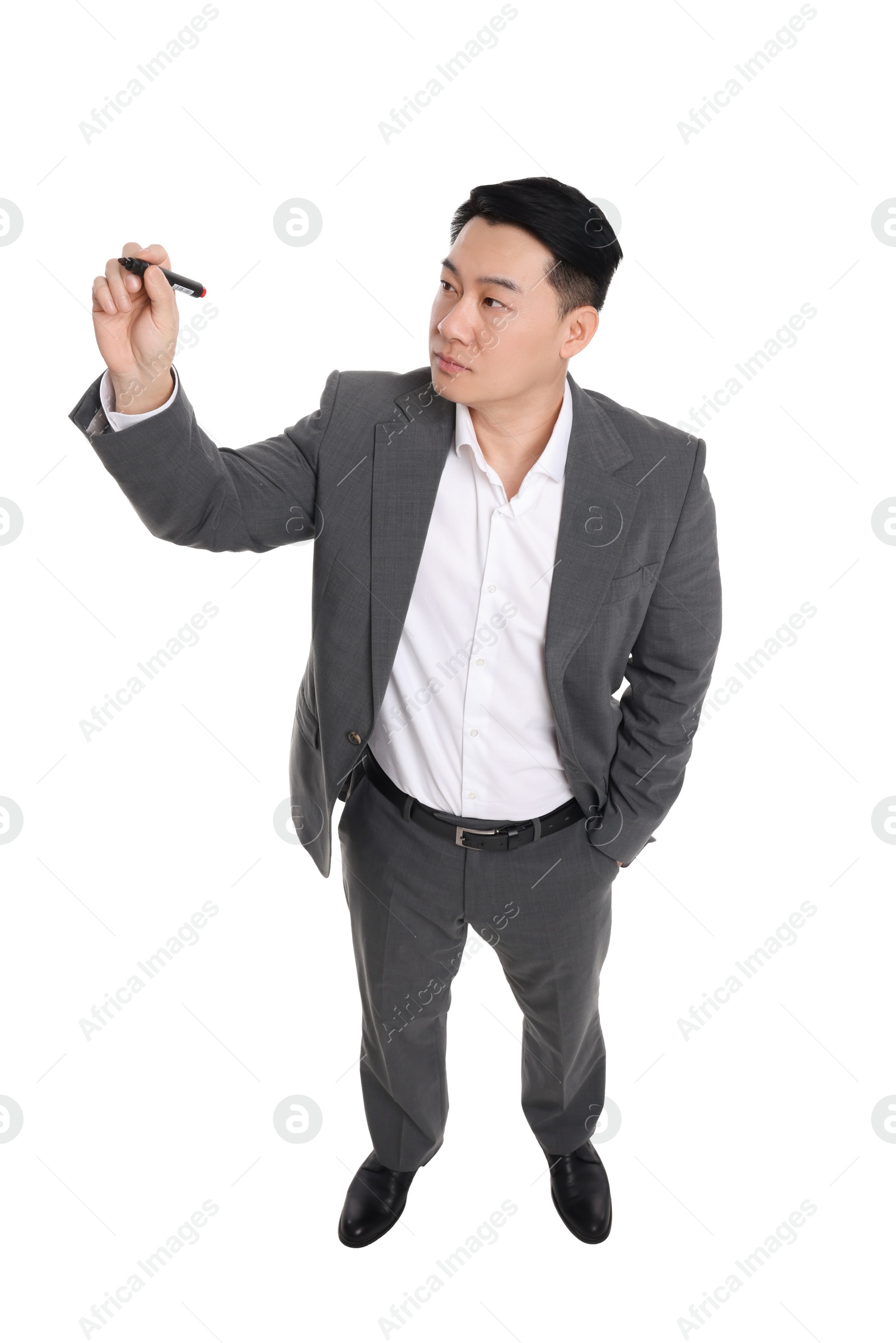 Photo of Businessman in suit with marker writing on white background, above view