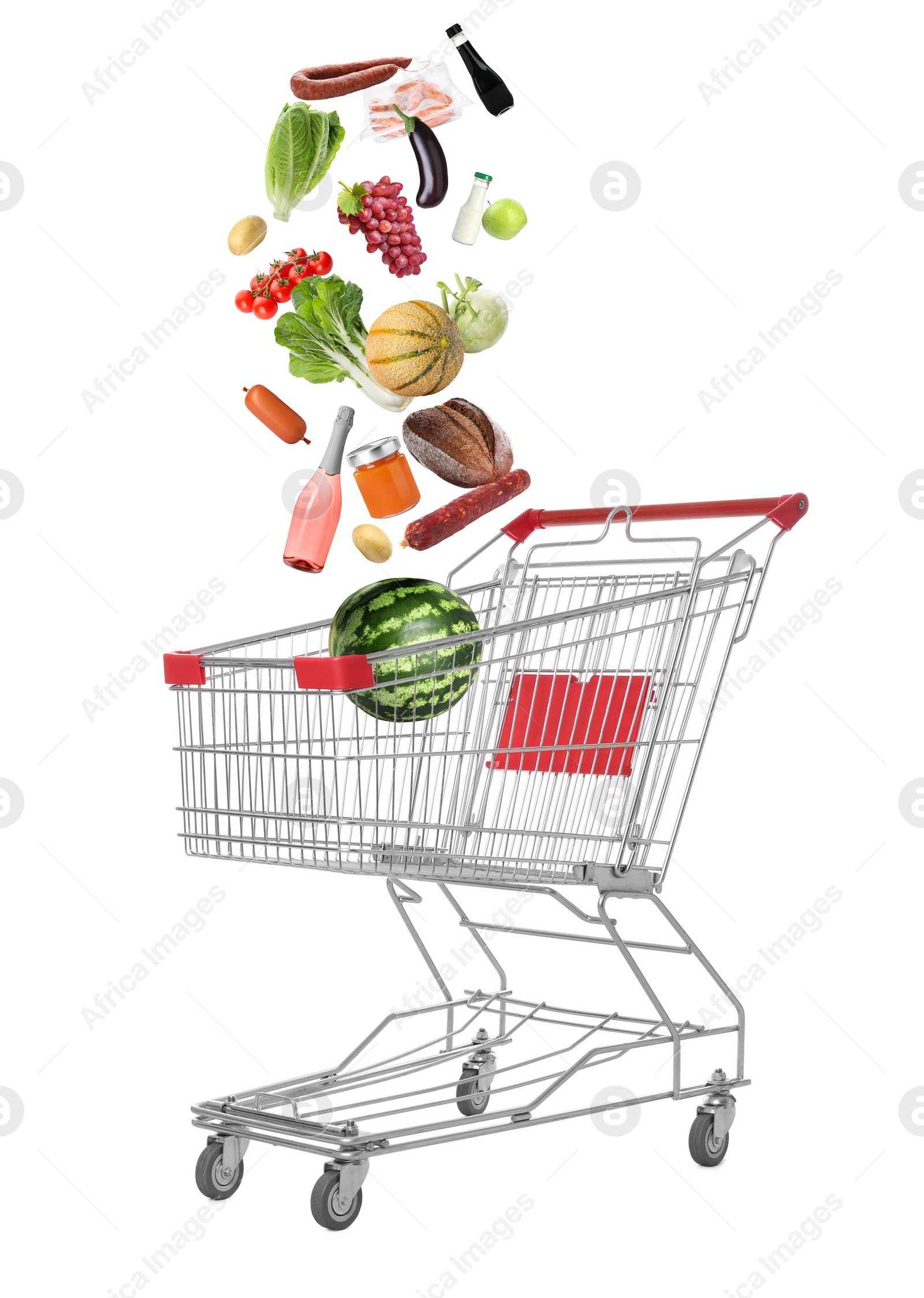 Image of Market assortment. Different products falling into shopping cart on white background