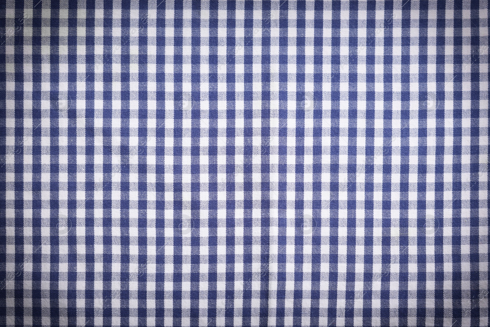 Image of Blue and white tablecloth as background, vignette effect