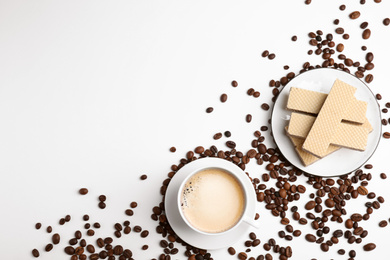 Breakfast with delicious wafers and coffee on white background, flat lay. Space for text