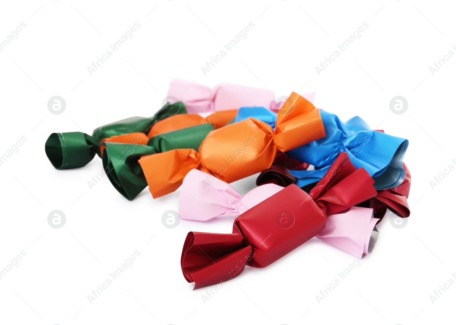 Photo of Delicious candies in colorful wrappers on white background