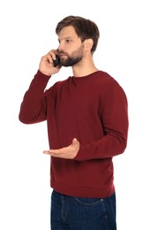 Photo of Man talking on smartphone against white background