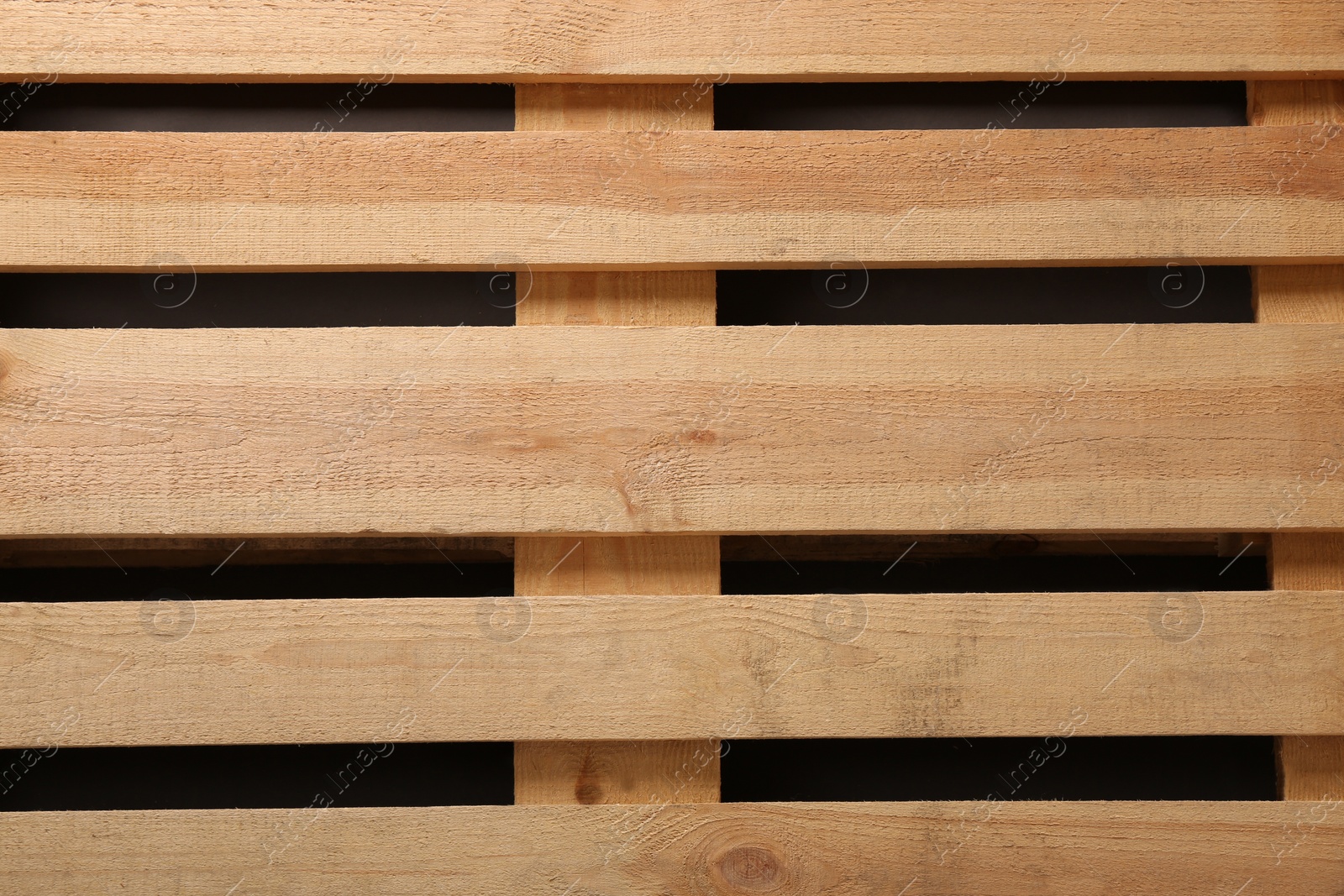 Photo of Wooden pallet as background, top view. Transportation and storage