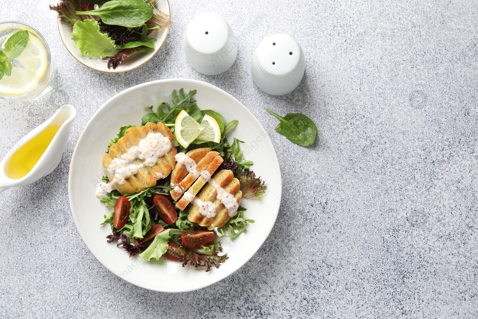 Photo of Flat lay composition with healthy dish high in vegetable fats on light textured table. Space for text