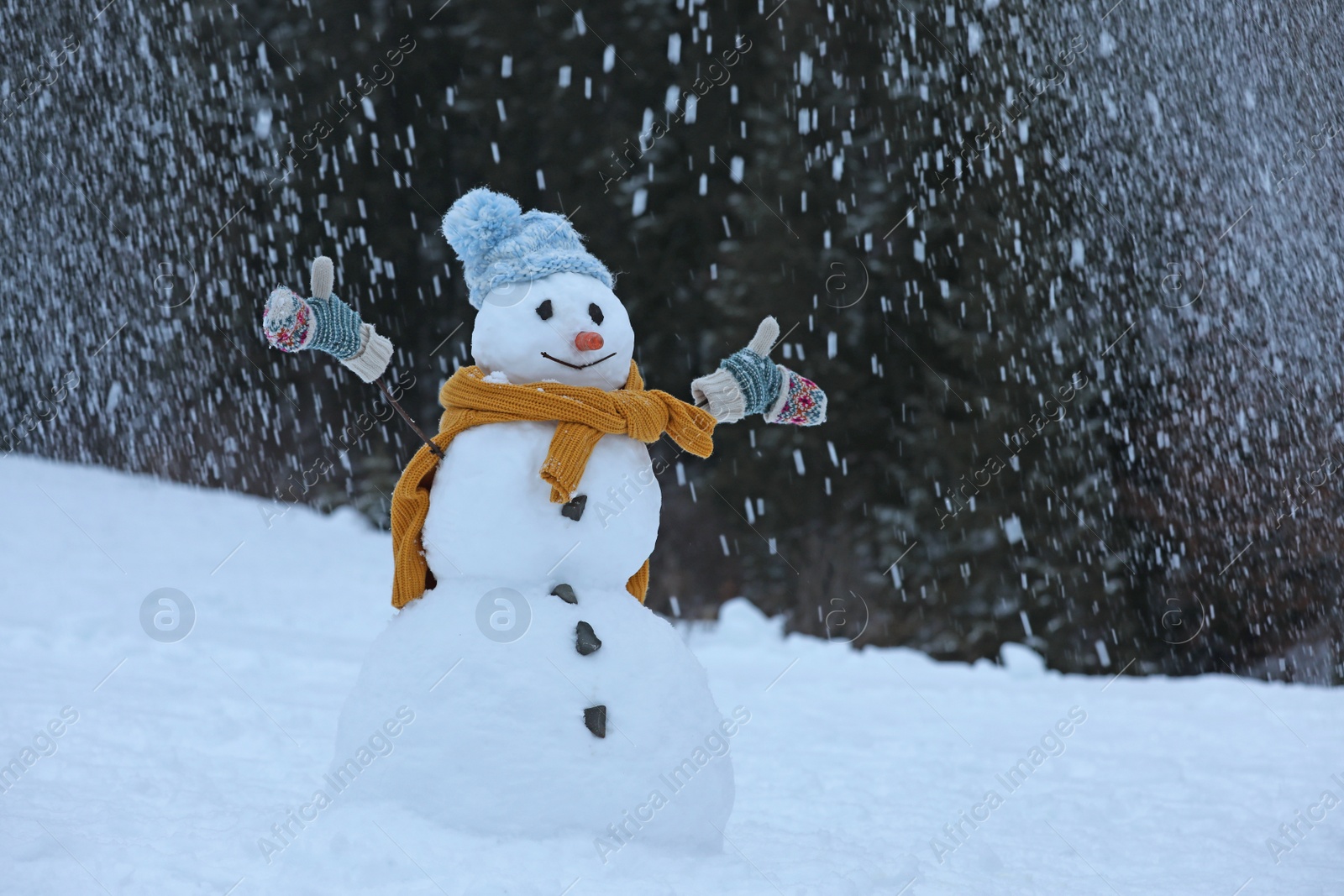 Photo of Adorable smiling snowman outdoors on winter day. Space for text