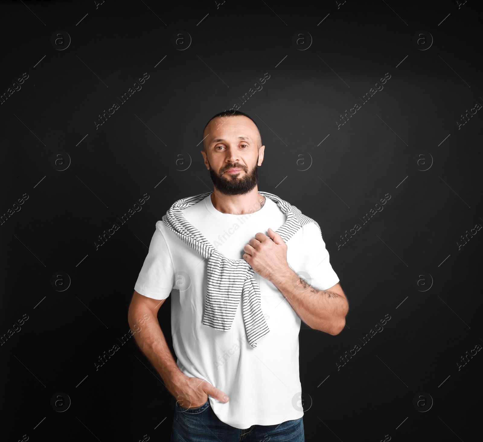 Photo of Portrait of handsome man on black background