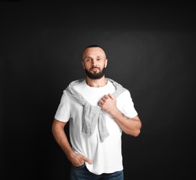 Portrait of handsome man on black background