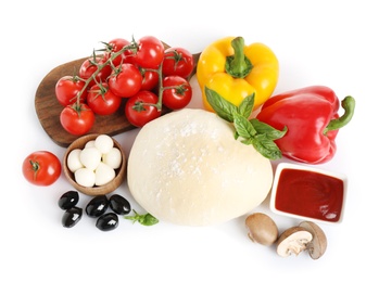 Photo of Fresh dough and ingredients for pizza on white background, top view