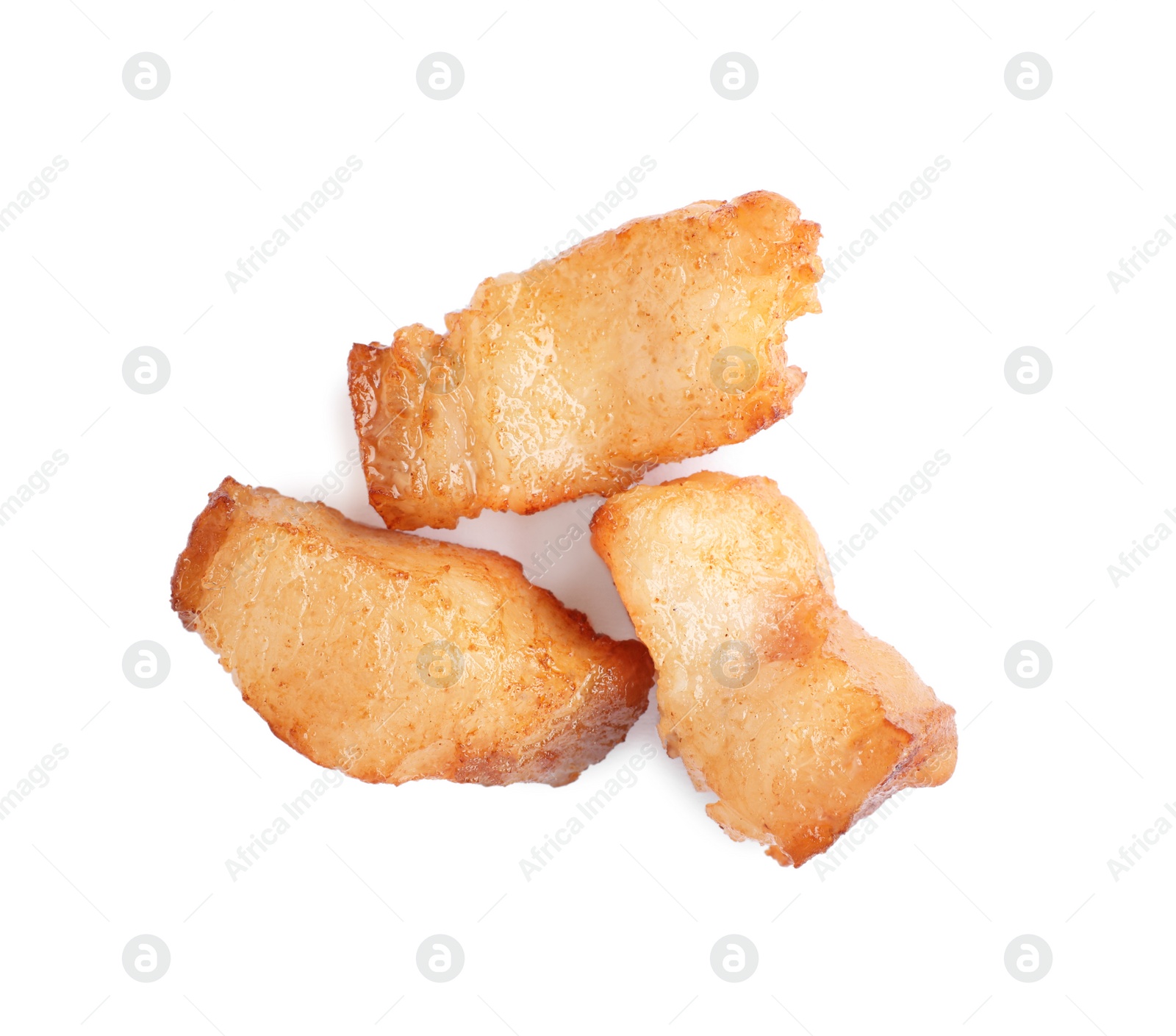 Photo of Tasty fried cracklings on white background, top view. Cooked pork lard