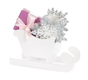 Wooden sleigh with present and Christmas decor on white background