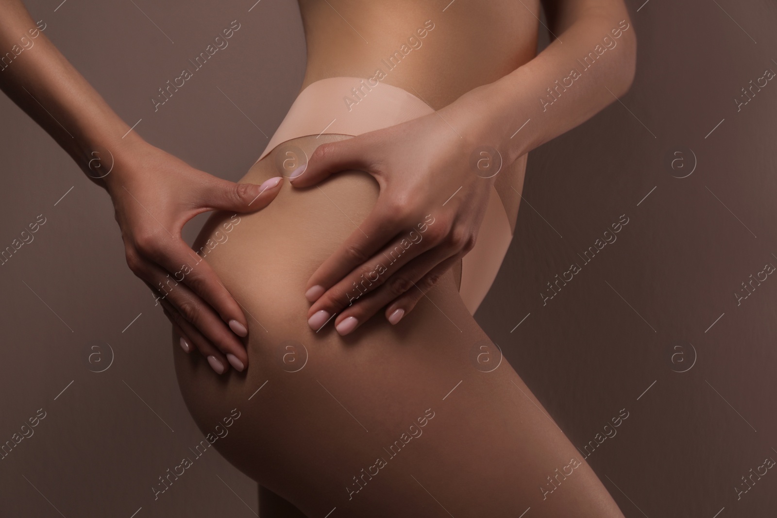 Photo of Closeup view of slim woman in underwear on color background. Cellulite problem concept