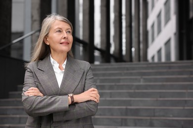 Portrait of beautiful woman outdoors, space for text. Lawyer, businesswoman, accountant or manager