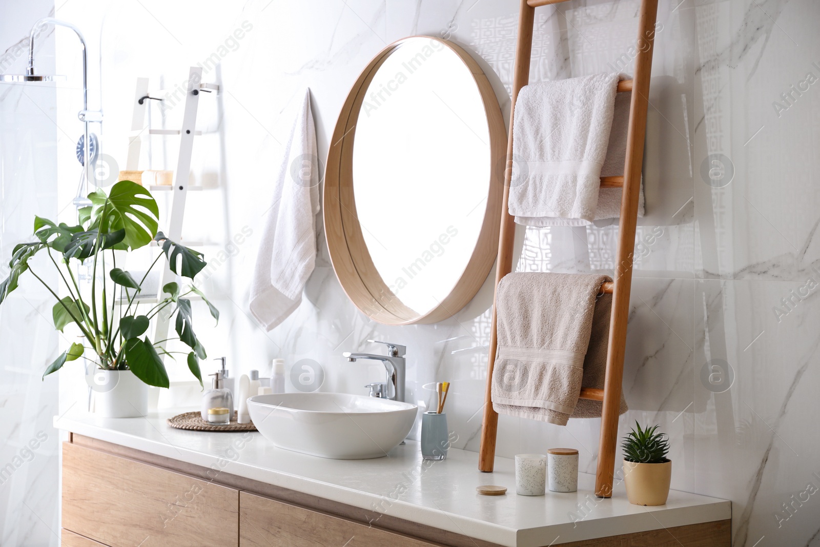 Photo of Decorative ladder near vessel sink in stylish bathroom. Idea for interior design