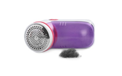 Photo of Modern fabric shaver and lint on white background