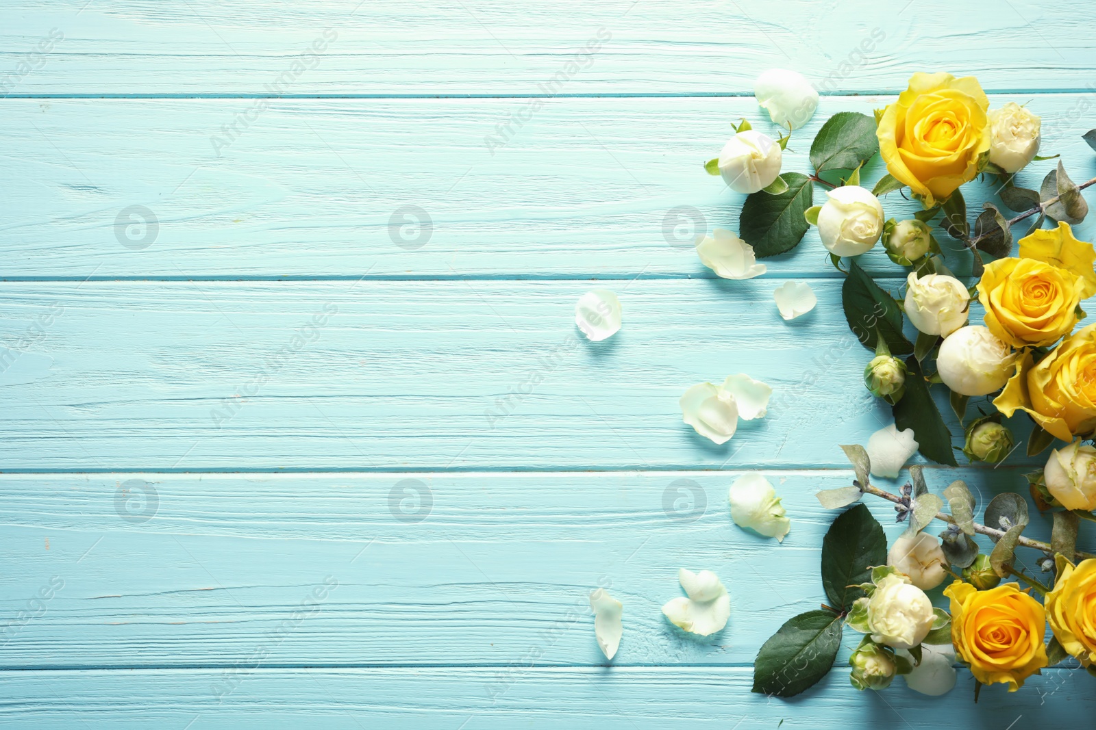 Photo of Flat lay composition with beautiful blooming flowers on wooden background