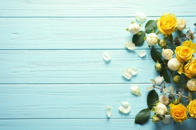 Photo of Flat lay composition with beautiful blooming flowers on wooden background