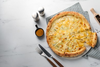 Photo of Delicious cheese pizza served on white marble table, flat lay. Space for text