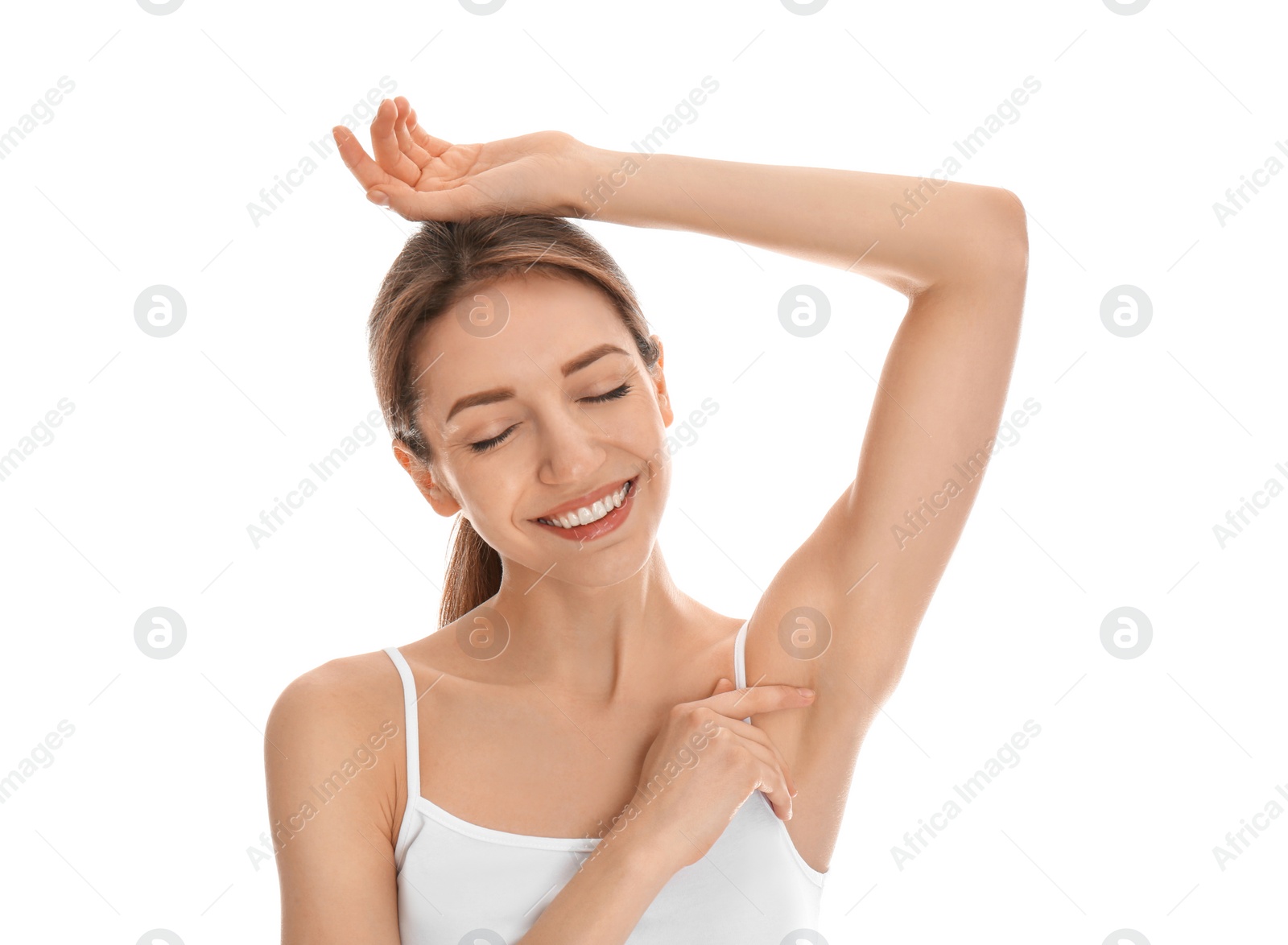 Photo of Young woman showing armpit with smooth clean skin on white background