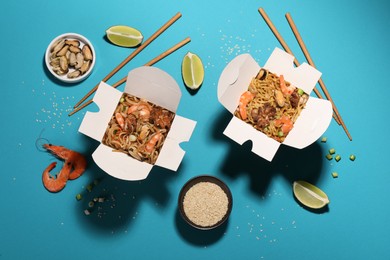 Photo of Boxes of wok noodles with seafood and chopsticks on turquoise background, flat lay