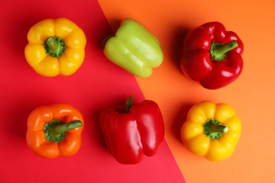 Photo of Flat lay composition with ripe bell peppers on color background