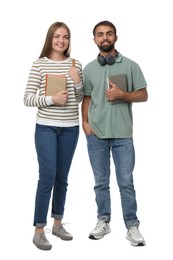 Photo of Happy students with books on white background