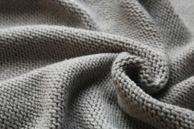 Photo of Beautiful grey knitted fabric as background, closeup