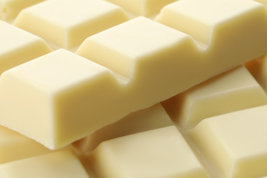 Photo of Delicious white chocolate as background, closeup view