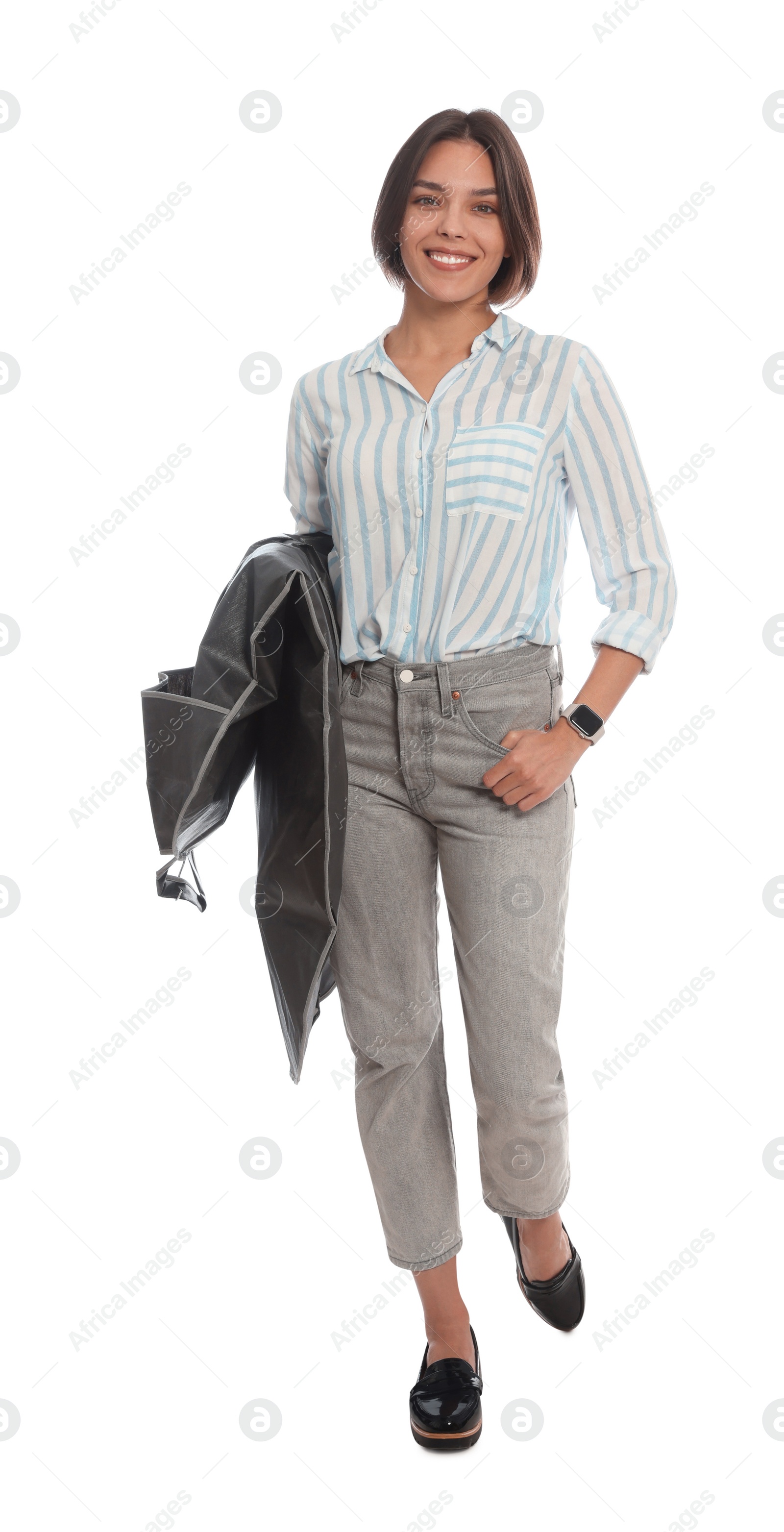 Photo of Woman holding garment cover with clothes on white background. Dry-cleaning service