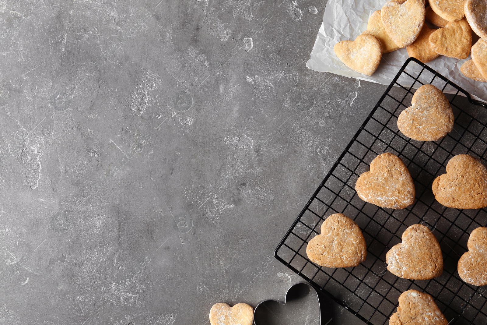 Photo of Flat lay composition with homemade heart shaped cookies and space for text on table