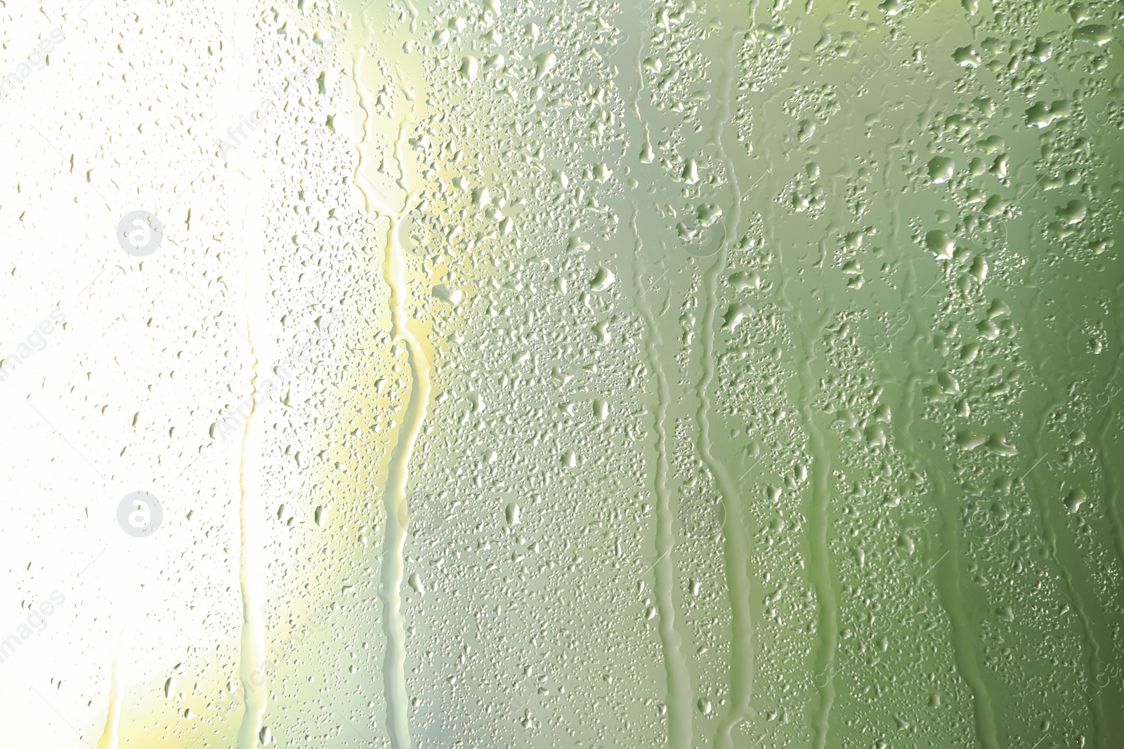 Photo of View of glass with water drops, closeup