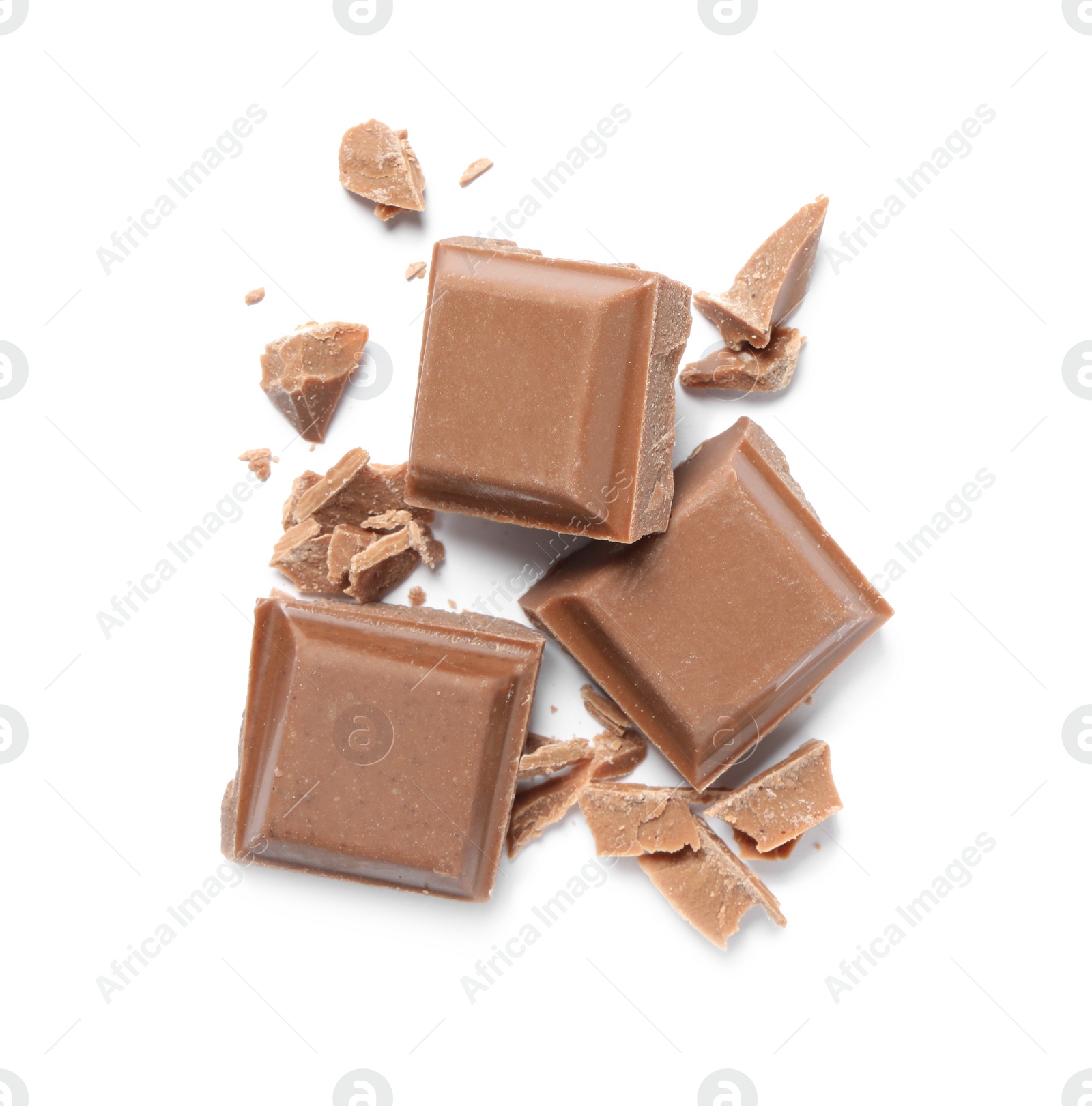 Photo of Pieces of delicious milk chocolate isolated on white, top view