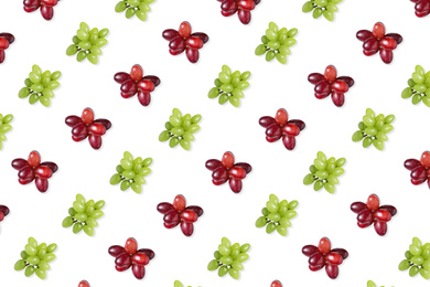 Image of Pattern of red and green grapes on white background