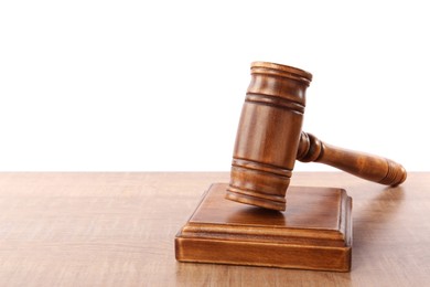 Photo of Gavel on wooden table against white background, space for text. Small mallet