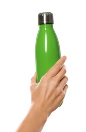 Photo of Woman holding green thermos bottle on white background, closeup