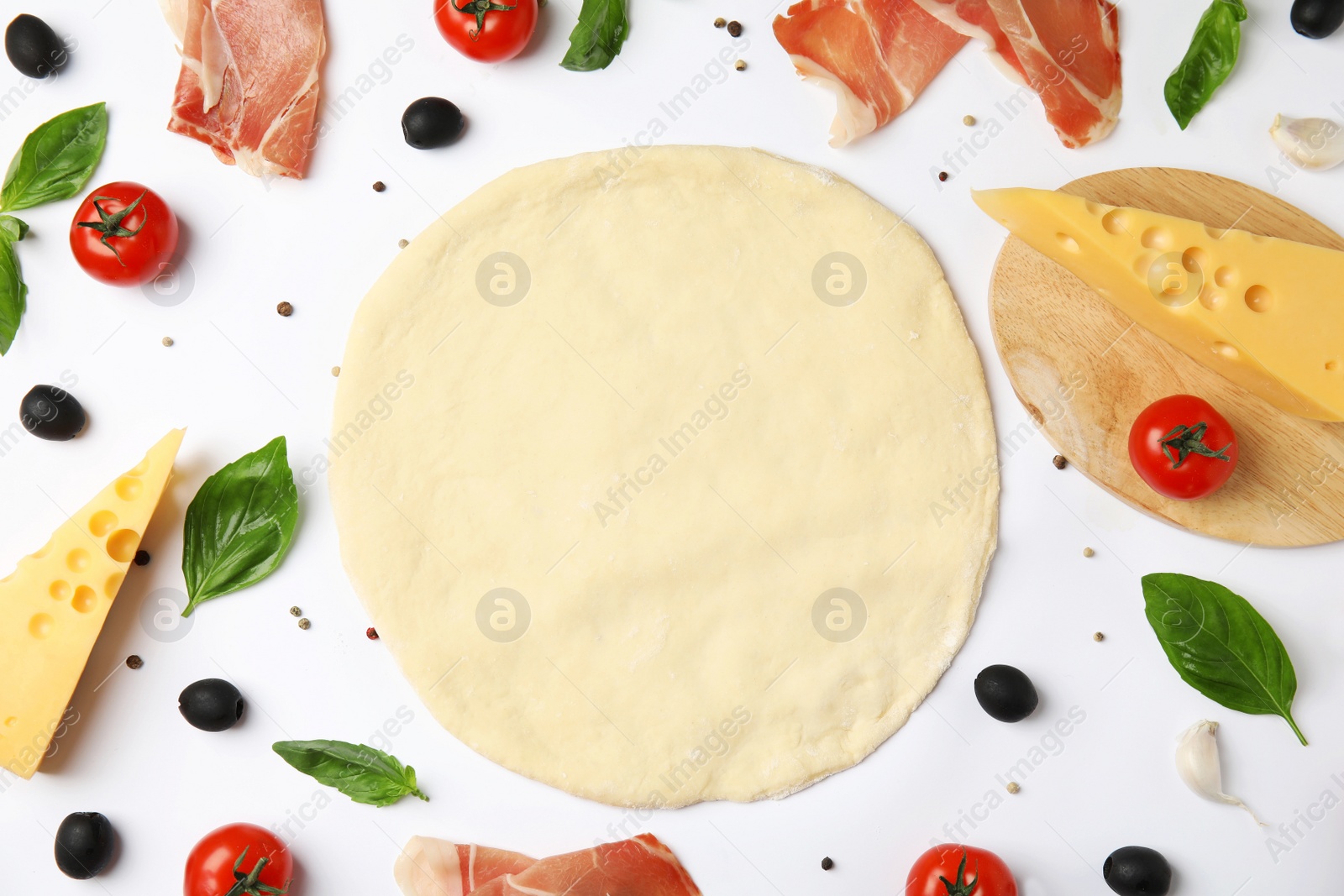 Photo of Flat lay composition with dough and fresh ingredients for pizza on white background