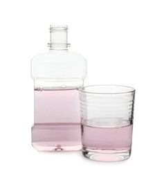 Photo of Bottle and glass with mouthwash on white background. Oral hygiene