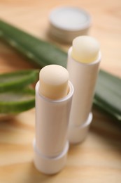 Different lip balms on table, closeup view