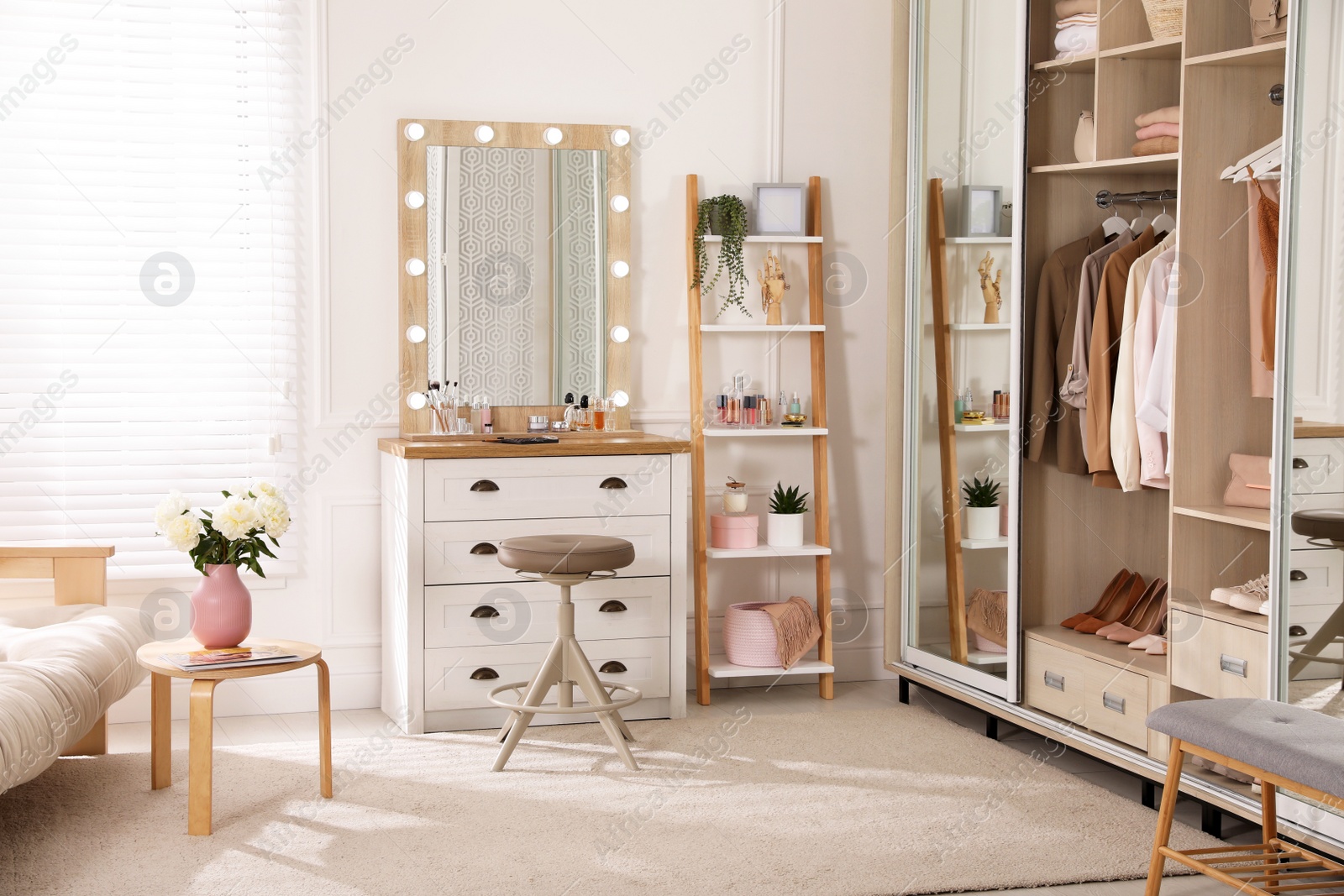 Photo of Elegant room with dressing table and wardrobe. Interior design