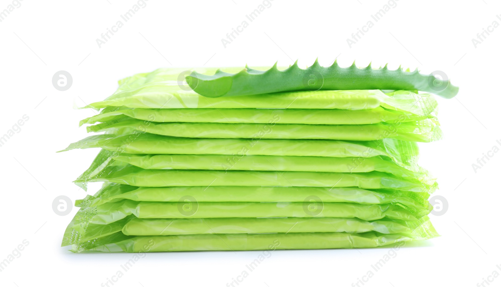 Photo of Stack of menstrual pads and aloe leaf on white background. Gynecological care